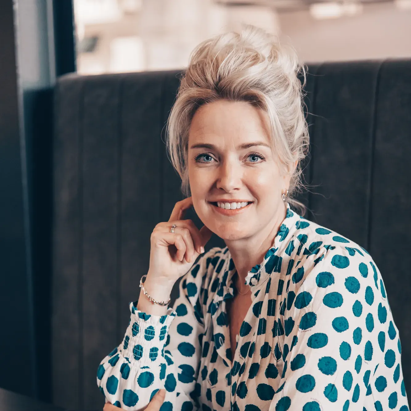 Rounded profile photo of a woman